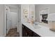 Bright bathroom featuring a large mirror, sink, and a view into an adjoining toilet room at 308 Masden Rd, Holly Springs, NC 27540