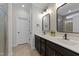 Modern bathroom with double vanity, black fixtures, and decorative tile at 308 Masden Rd, Holly Springs, NC 27540