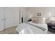 Comfortable bedroom featuring a bed with decorative pillows and two doors at 308 Masden Rd, Holly Springs, NC 27540