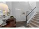 Inviting foyer with staircase, hardwood floors, and natural light at 308 Masden Rd, Holly Springs, NC 27540