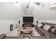 Finished basement area with a ceiling fan, a TV, and a comfortable sofa at 310 Macallan, Burlington, NC 27215