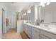 A modern bathroom with double sinks, and a tiled shower at 310 Macallan, Burlington, NC 27215