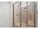 A glass door shower with tile and a built-in bench at 310 Macallan, Burlington, NC 27215