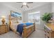 Bright bedroom featuring neutral carpet, a ceiling fan, a window, and a wooden bed frame at 310 Macallan, Burlington, NC 27215