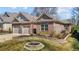 A beautiful brick house with a manicured front lawn and a two-car garage at 310 Macallan, Burlington, NC 27215