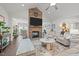 Spacious living room features a stone fireplace, ceiling fan, and lots of natural light at 310 Macallan, Burlington, NC 27215