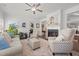 Cozy living room with a fireplace, comfortable seating, and lots of plants at 310 Macallan, Burlington, NC 27215
