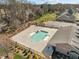 Community pool area featuring a fenced-in pool, landscaping, and seating area at 310 Macallan, Burlington, NC 27215