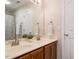 Bathroom featuring a double sink vanity, a large mirror, and neutral decor and finishes at 314 Montelena Pl, Cary, NC 27513