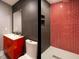 Sleek bathroom featuring a modern vanity, toilet, and red-tiled shower at 314 Montelena Pl, Cary, NC 27513