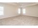 Spacious bedroom boasts natural light, neutral walls and plush carpeting at 314 Montelena Pl, Cary, NC 27513
