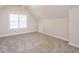 Attic bedroom with carpet floors, neutral walls, and a window providing plenty of natural light at 314 Montelena Pl, Cary, NC 27513