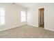 Bedroom featuring neutral walls, carpet floors, and windows providing plenty of natural light at 314 Montelena Pl, Cary, NC 27513