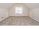 Attic bedroom with carpet floors, neutral walls, and windows providing plenty of natural light at 314 Montelena Pl, Cary, NC 27513