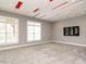 Carpeted bonus room featuring recessed lighting, unique ceiling details, and a wall-mounted television at 314 Montelena Pl, Cary, NC 27513