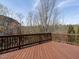Wooden deck with railing overlooking backyard foliage at 314 Montelena Pl, Cary, NC 27513