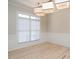Classic dining room with hardwood floors, wainscoting, and abundant natural light from a large window at 314 Montelena Pl, Cary, NC 27513