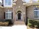 Inviting entryway featuring an arched doorway and elegant brick detailing at 314 Montelena Pl, Cary, NC 27513