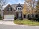 Beautiful two-story brick home with a manicured lawn and a welcoming front yard at 314 Montelena Pl, Cary, NC 27513
