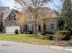 Charming two-story brick home with mature landscaping and a well-maintained lawn at 314 Montelena Pl, Cary, NC 27513