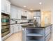 Beautiful kitchen with stainless steel appliances, ample counter space and modern cabinetry at 314 Montelena Pl, Cary, NC 27513