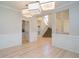 Spacious living room featuring hardwood floors, decorative molding, and elegant light fixtures at 314 Montelena Pl, Cary, NC 27513