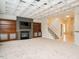 Open-concept living room with fireplace and staircase at 314 Montelena Pl, Cary, NC 27513