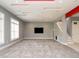 Spacious living room features gray walls, red ceiling accents, recessed lighting, and carpeted flooring at 314 Montelena Pl, Cary, NC 27513