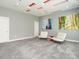 Contemporary living room with gray walls, white seating, and custom ceiling design with recessed lighting at 314 Montelena Pl, Cary, NC 27513
