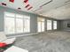 Spacious living room with carpeted floors, custom ceiling design, and multiple windows with ample natural light at 314 Montelena Pl, Cary, NC 27513