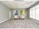 Inviting living room with gray walls, carpeted floors, recessed lights, two chairs, and abstract wall art at 314 Montelena Pl, Cary, NC 27513