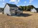 Backyard view of new home with a covered patio at 316 Little Lady Trail, Zebulon, NC 27597