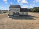 Backyard view of new home with covered porch at 316 Little Lady Trail, Zebulon, NC 27597