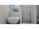 Modern bathroom with a soaking tub and glass-enclosed shower at 316 Little Lady Trail, Zebulon, NC 27597