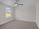Sunlit bedroom featuring neutral walls, carpet flooring, and large window with beautiful view at 316 Little Lady Trail, Zebulon, NC 27597