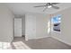 Bedroom with neutral carpet, a ceiling fan, and a bright window at 316 Little Lady Trail, Zebulon, NC 27597