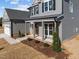 Two-story home with porch, garage, and landscaped yard at 316 Little Lady Trail, Zebulon, NC 27597