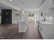 Spacious kitchen with white cabinets, granite countertops, and modern appliances at 316 Little Lady Trail, Zebulon, NC 27597