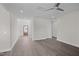 Spacious living room featuring hard surface floors, neutral paint, and natural light from the front door at 316 Little Lady Trail, Zebulon, NC 27597