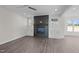 Comfortable living room with a dark fireplace, wood floors, and neutral paint colors at 316 Little Lady Trail, Zebulon, NC 27597
