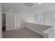 Light-filled loft area with neutral carpet and access to additional rooms at 316 Little Lady Trail, Zebulon, NC 27597