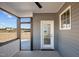 Covered porch with ceiling fan and open view of backyard at 316 Little Lady Trail, Zebulon, NC 27597