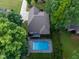 Aerial view of a home featuring a swimming pool, lush greenery, and a spacious backyard at 3421 Griffice Mill Rd, Raleigh, NC 27610