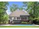 Inviting backyard with a refreshing pool, deck, screened in porch, and lush landscaping at 3421 Griffice Mill Rd, Raleigh, NC 27610