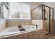 Relaxing bathroom with a large soaking tub and a separate glass shower at 3421 Griffice Mill Rd, Raleigh, NC 27610
