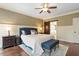 Comfortable bedroom with hardwood floors and barn door to bath at 3421 Griffice Mill Rd, Raleigh, NC 27610