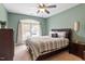 Cozy bedroom features a ceiling fan, a large window for natural light, and stylish furniture at 3421 Griffice Mill Rd, Raleigh, NC 27610