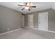Spacious bedroom featuring neutral tones, a ceiling fan and bright white trim at 3421 Griffice Mill Rd, Raleigh, NC 27610