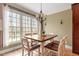 Cozy dining area with large windows and a stylish chandelier at 3421 Griffice Mill Rd, Raleigh, NC 27610