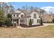 Charming two-story brick home with a well-manicured lawn and inviting curb appeal at 3421 Griffice Mill Rd, Raleigh, NC 27610